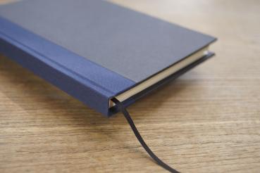 Writing and notebook black, with marine blue linen